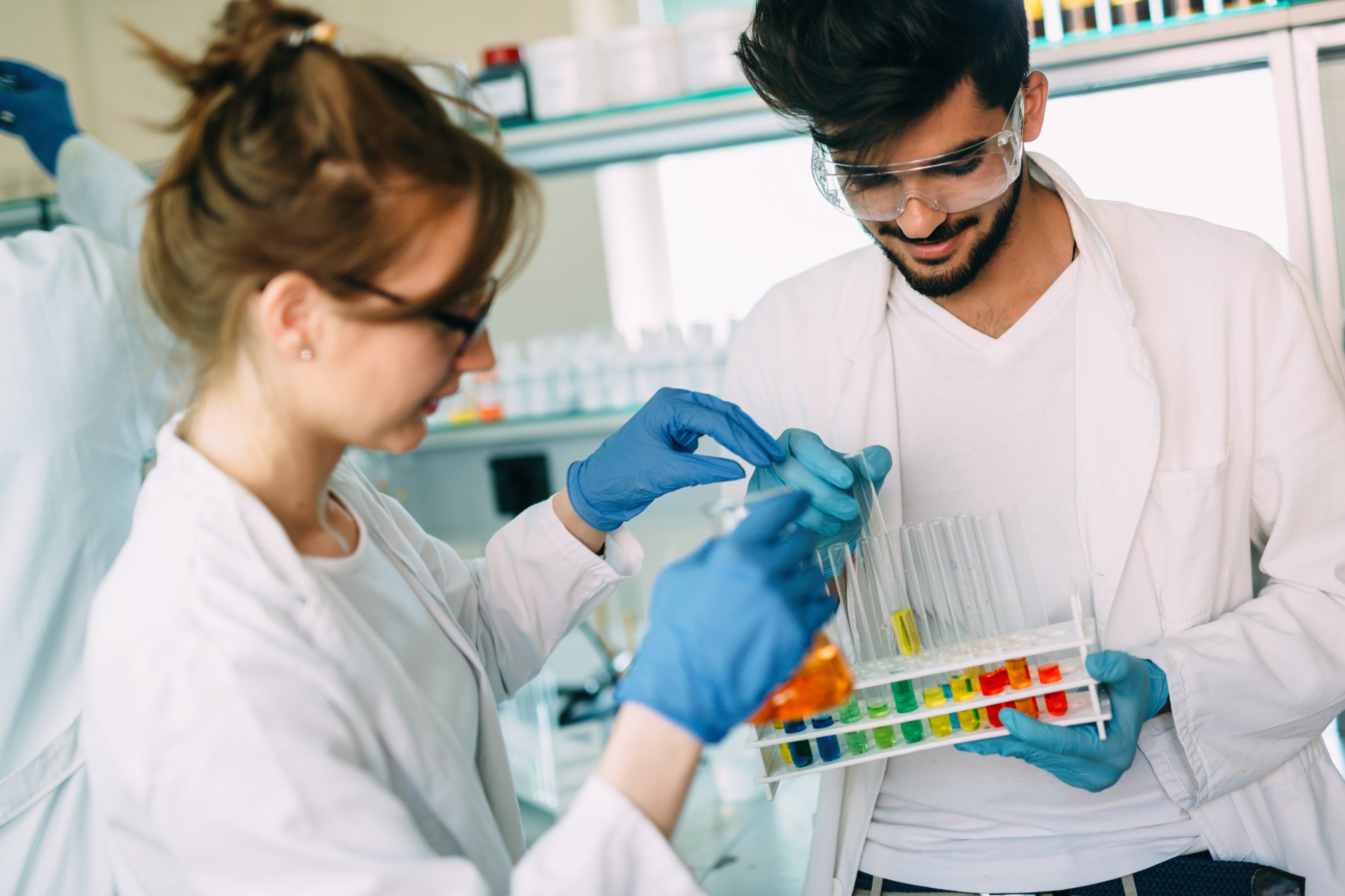 2 students looking at samples in test tubes (c) iStock 2 students looking at samples in test tubes (c) iStock